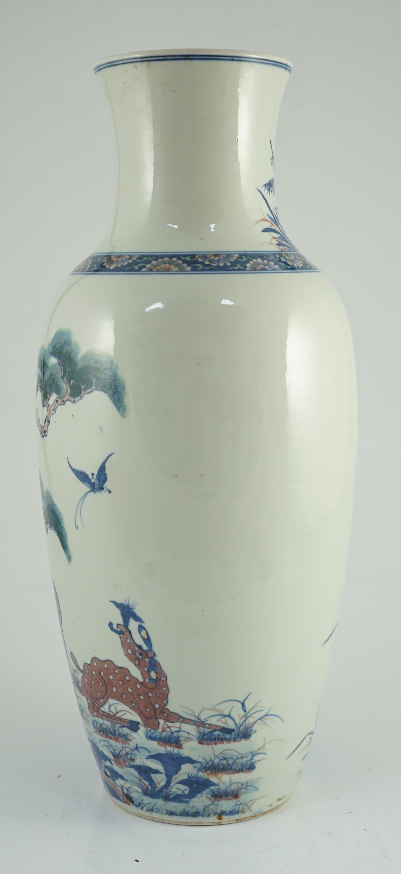 An unusual Chinese green enamelled underglaze blue and copper red tall vase, 19th century, 46.4cm high